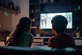Fototapeta  - Back view teenage Indian girl and boy in front of television screen. Children siblings home cinema time. Generate ai