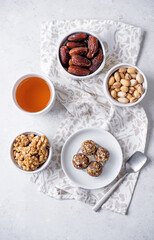 Wall Mural - Dates and nuts raw healthy balls in a plate