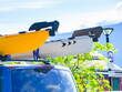 Car with canoe on top roof
