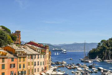 Wall Mural - Elevated view of the small harbour of the fishing village, popular holiday destination in the Italian Riviera, in summer, Portofino, Genoa, Liguria, Italy