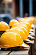 © saquizeta - Many yellow hardhat helmet on row in construction site. Backgorund Construction hard hat safety helmet workers for engineering protection head standard. industry and construction concept