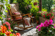 Cozy wooden terrace with rustic furniture, soft colorful pillows and blankets, rocking chair and flower pots. Charming sunny evening in summer garden.
