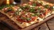 board of flatbreads topped with prosciutto and arugula