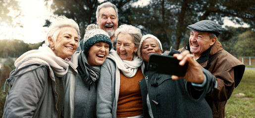 Wall Mural - Excited, selfie and group of senior friends in outdoor green environment for fresh air. Diversity, happy and elderly people in retirement taking picture together while exploring and bonding in a park