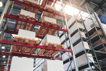 Fototapete - modern distribution warehouse with boxes on racks