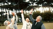 © Clement C/peopleimages.com - Hands, team building and senior friends in a huddle outdoor for support, celebration or unity during a game. Teamwork, trust and community with a group of elderly people in a park for motivation