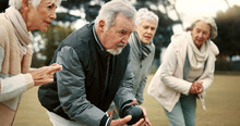 Senior Man, Game And Senior People Bowling In Nature For Retirement Sports, Teamwork And Support. Bowling, Friends And Elderly Man And Woman In A Group With A Ball For A Competition On A Field Togeth