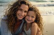 © Fotograf - A woman and a little girl enjoying their time on the beach. Perfect for family vacations and summer-themed designs