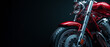 Closeup on a red modern motorcycle isolated on a dark background
