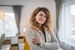 © Miljan Živković - Portrait of adult caucasian woman with curly hair at home happy smile