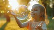 Happy children play with soap bubble in amusement summer park wallpaper background