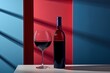 bottle and a glass of red wine are placed on a wooden table against a blue background with gobo shadow effect