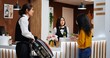 © DC Studio - Front desk staff giving key card and passport after check in, asian woman arriving at five star hotel and registering. Traveler receiving room access and id documents, ensuring pleasant stay.