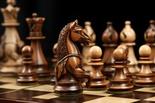 Chess Board. Wooden Chess Pieces On A Chessboard, Close-up. Horse Is On Focus. Vintage Wooden Chess Pieces  On The Chess  Board. Strategy And Competition Concept.