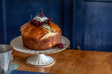 Panettone bread with cherries and whipped cream