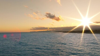 Wall Mural - Sun beam kissing the surface of the Ocean 