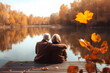 elderly couple sitting side by side on a wooden dock that extends into a calm lake. They are surrounded by trees adorned with golden autumn leaves