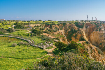 Wall Mural - Wooden boardwalk along the cliffs in Lagos, Algarve, Portugal