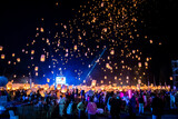 Fototapeta  - Sky lantern mass release event for Yee Peng and Loy Krathong traditional festival in Chiang Mai, Thailand