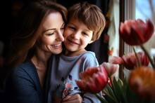 Mom Hugs Her Cute Little Son With A Smile And Tenderness. Mother's Day, Birthday, March 8