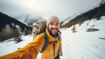 Frosty Selfie Expedition: Young Man in Winter Apparel Capturing Memories on a Snowy Mountain
