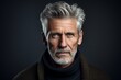 © Inigo - Portrait of a handsome mature man with grey hair and beard.