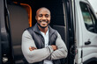 © macattack - Portrait of happy black professional driver getting out of his truck