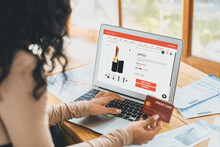 Woman Shopping Online On Internet Marketplace Browsing For Sale Items For Modern Lifestyle And Use Credit Card For Online Payment From Wallet Protected By Crucial Cyber Security Software