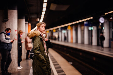 Wall Mural - Vigilant Commuter Awaiting Train