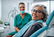 © mischenko - Satisfied elderly woman in the dentist's office looks at the camera.