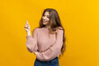 © makedonski2015 - Photo captures the essence of comfort and warmth. A beautiful woman in a soft sweater stands out against a vibrant yellow background. The texture of her hair and sweater creates a visual harmony