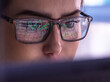© Westend61 - Businesswoman wearing eyeglasses analyzing financial market data on computer
