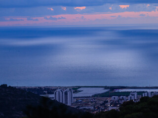 A cloudy sunset over the Mediterranean coastline