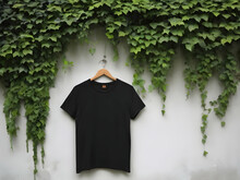 A Wall There Is Creeper Leaves And There Side Hanging A Black Colour T Shirt Wall Is Vintage Look