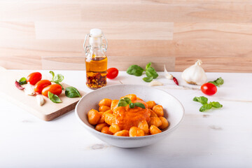 Wall Mural - Potato gnocchi with fresh tomatoes sauce. Typical Italian food.