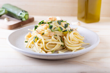 Wall Mural - Spaghetti with shrimp and courgettes. Balanced and nutritious dish suitable for lunch and dinner.