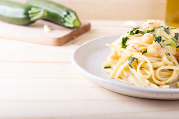 Wall Mural - Spaghetti with shrimp and courgettes. Balanced and nutritious dish suitable for lunch and dinner.