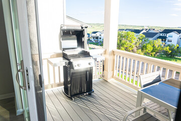 Wall Mural - Brand New Two-Burner Grill Stationed on Balcony