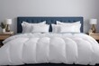 White pillows and duvet on the blue bed. White pillows, duvet and duvet case on a blue bedroom
