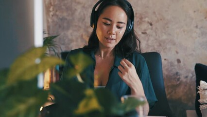 Poster - Woman, headset and talking as consultant at computer for customer service, virtual assistant or internet communication. Female person, writing and notebook or remote work, freelancer or online agent
