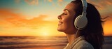 Inspired happy serene female with closed eyes enjoying of listening calm music with beautiful view at sunset time Relief stress and healthy minds. Creative Banner. Copyspace image