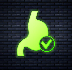 Wall Mural - Glowing neon Human stomach health icon isolated on brick wall background. Vector