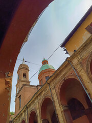 Sticker - Exterior arcades in perspective with dome and bell tower of San Bartolomeo and Gaetano church, Bologna ITALY