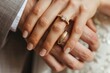 Golden wedding rings on newly married couple hands