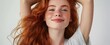 © Andrei - Radiant Red-Haired Young Woman with Freckles and a Joyous Expression Embracing Her Natural Beauty in a Light-Filled Minimalistic Setting