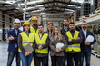 © Halfpoint - Full team of warehouse employees standing in warehouse. Team of workers, managers, female director and worker with down syndrome in modern industrial factory, heavy industry, manufactrury.