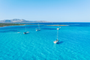 Sticker - Drone view of a sailing yacht. Vacationing people. Vacation and holidays. Summer time for sea travel. The sea bay. Photo for background and wallpaper. Mediterranean Sea.