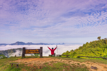 Wall Mural - Man tourist with his orange tent in Mae Moei Nationnal Park border of Thailand and Myan Mar, Tak province Thailand.