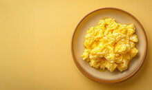 Tasty Scrambled Egg On A Plate On A Clear Background With Copy Space For Text, Top View