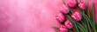 Mother's Day abstract pink color background decorated with tulips pink flowers. Banner with copy space